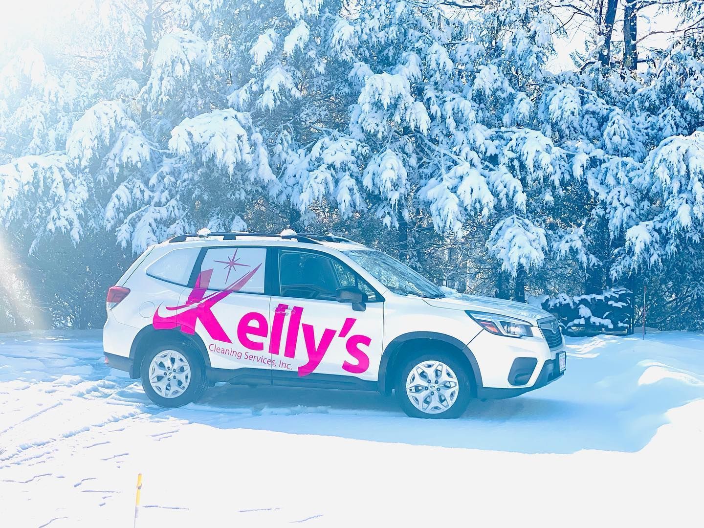 White SUV with pink logo