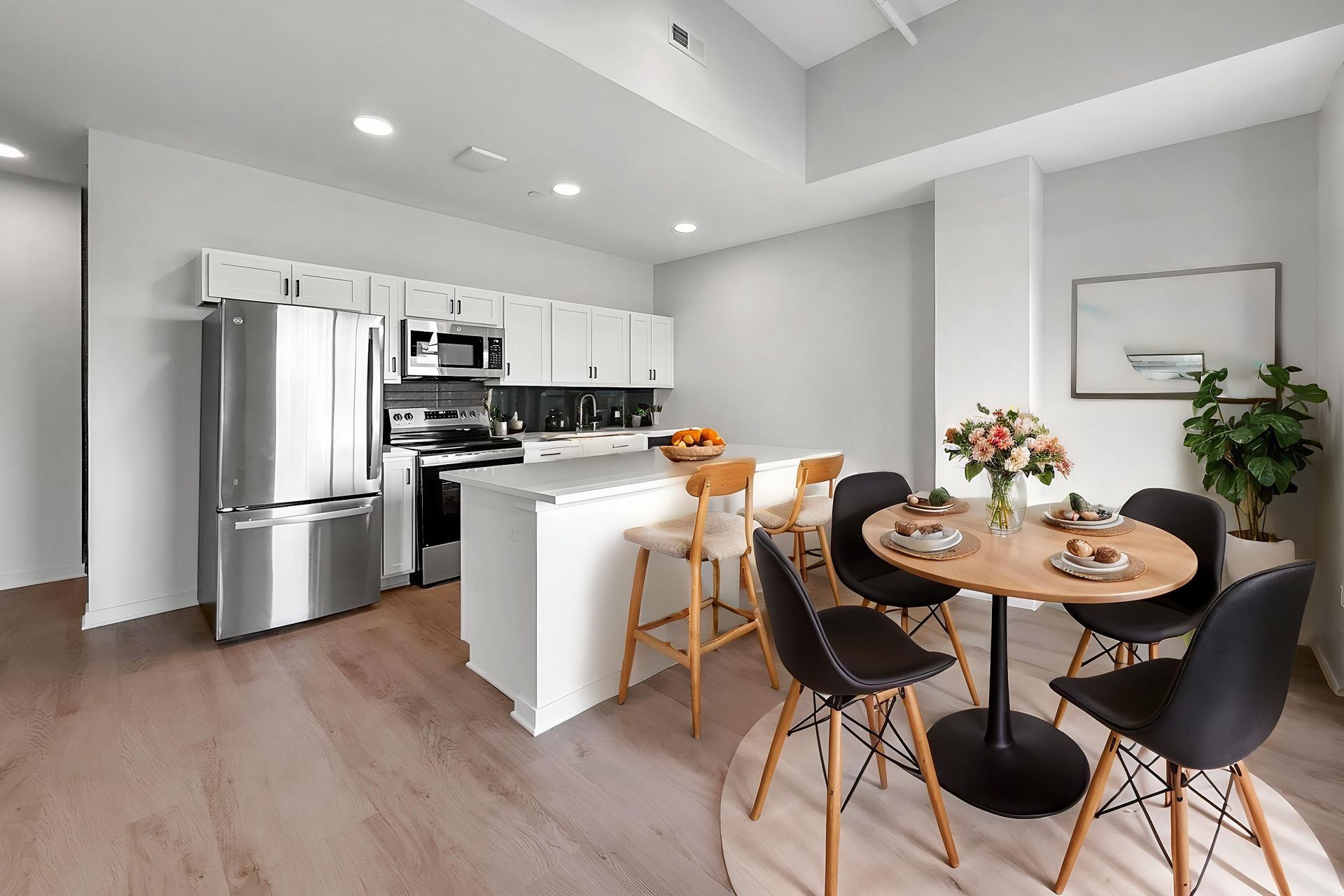 Great kitchen breakfast bar and sitting area with stainless steel appliances
