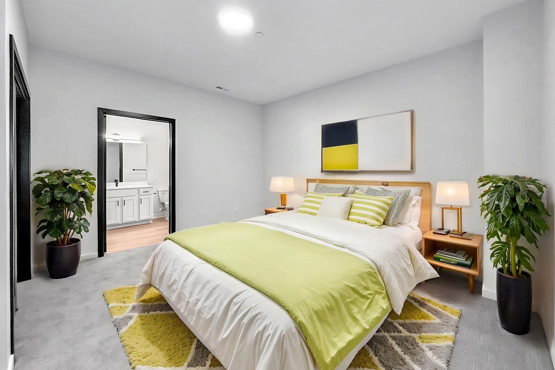 Modern bedroom with lime green sheets in the new walk up homes at Cityville on 9th