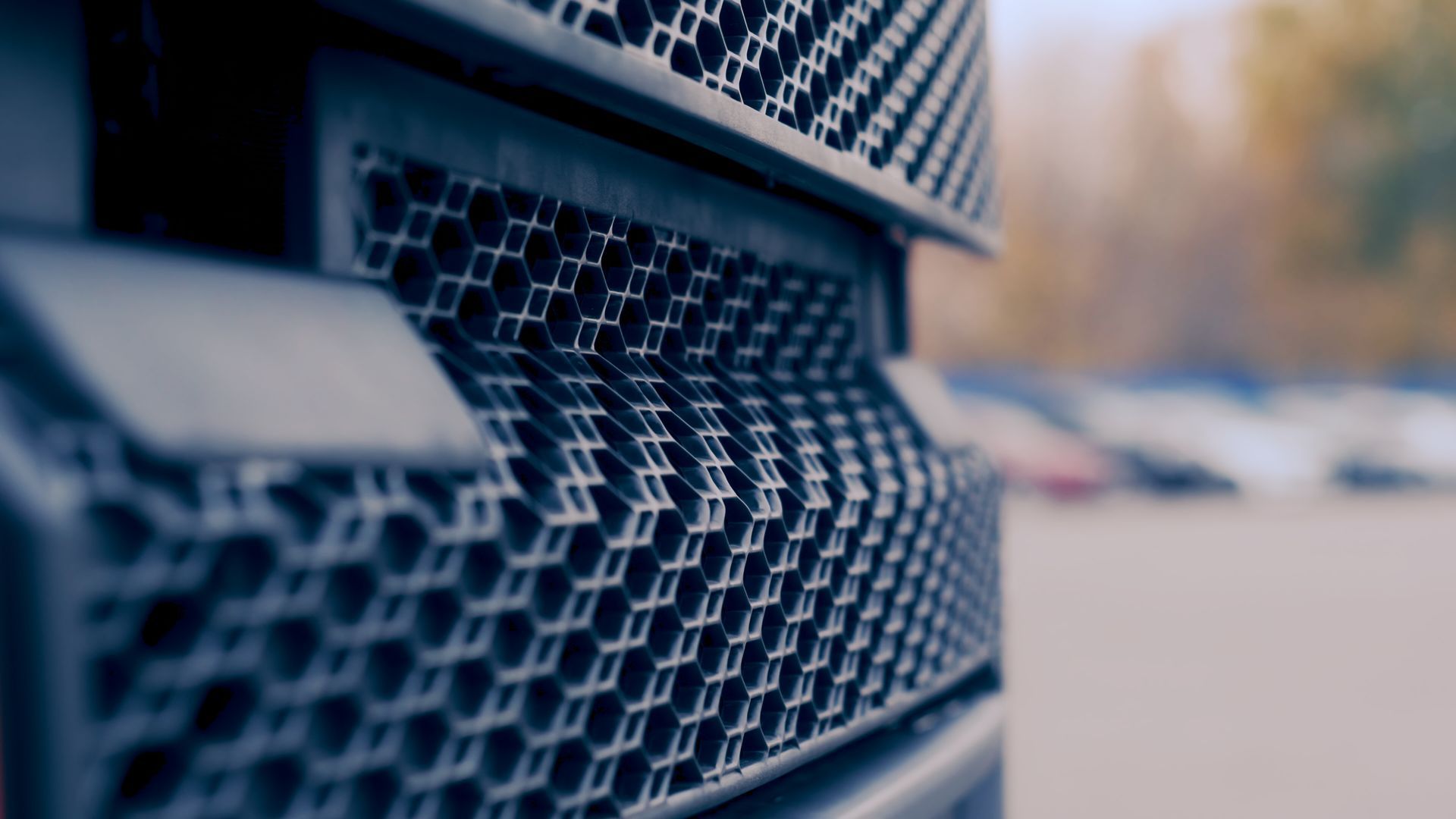 Close-up view of cargo truck radiator grille.