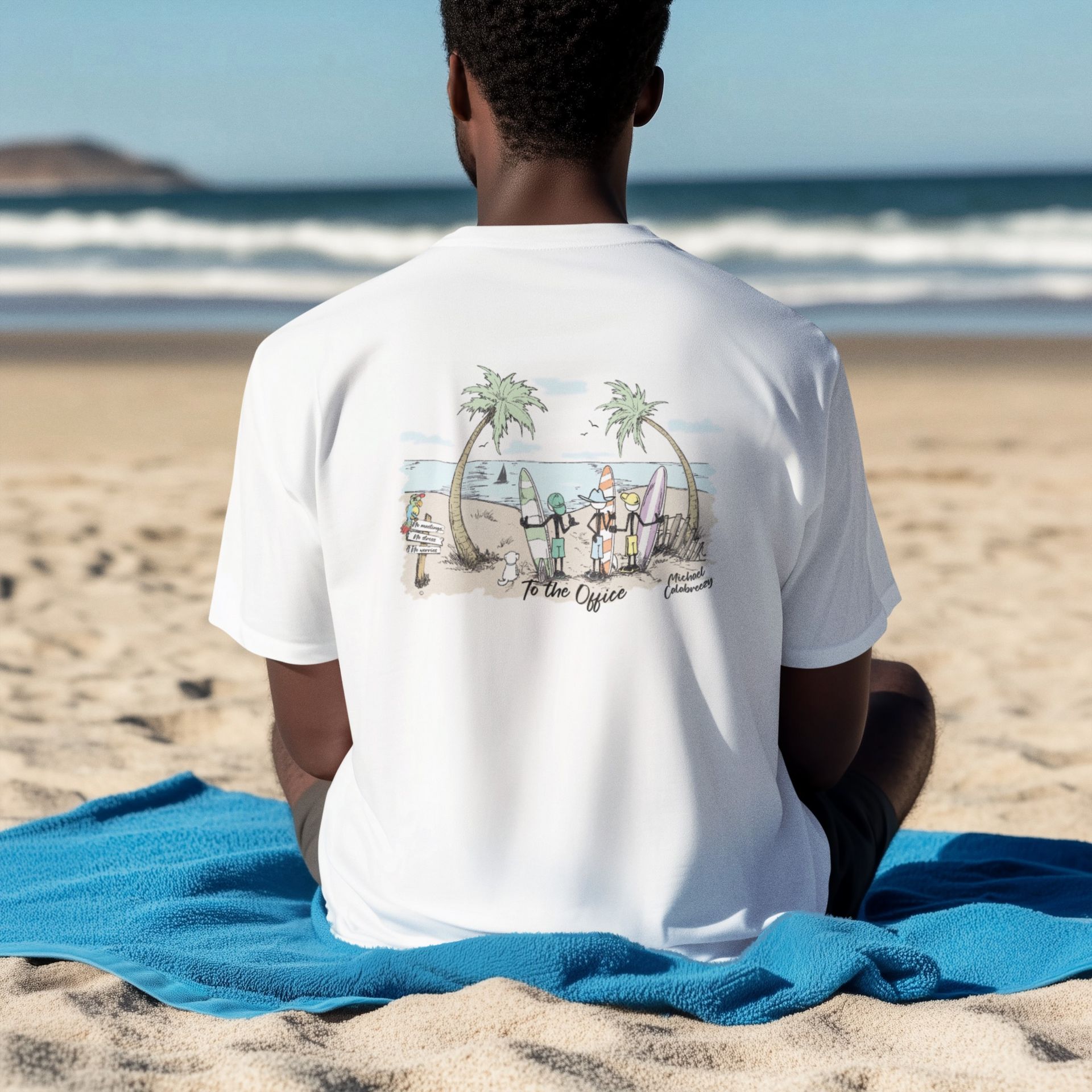 Man on beach wearing white t-shirt with cartoon beach scene on the back.