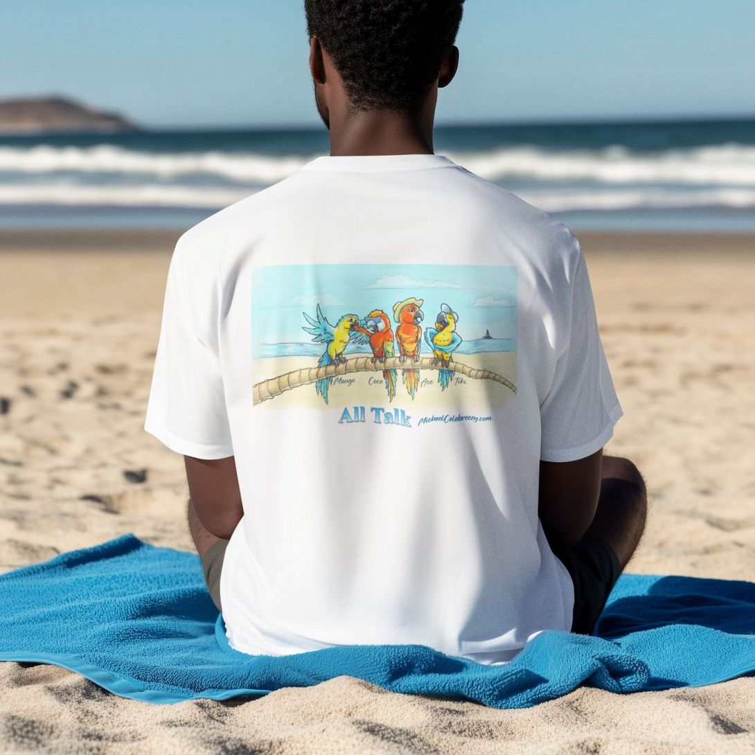 Person on beach wearing a white t-shirt with a colorful parrot design on the back. Blue ocean backdrop.