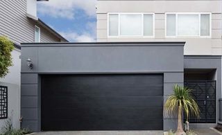 grey house with modern garage doors