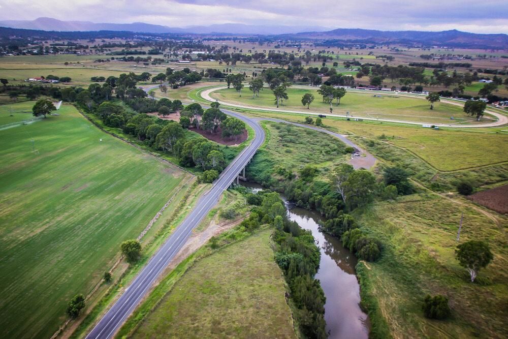An Aerial View of a River and a Road in the Countryside — TPF Industries in Rural View, QLD
