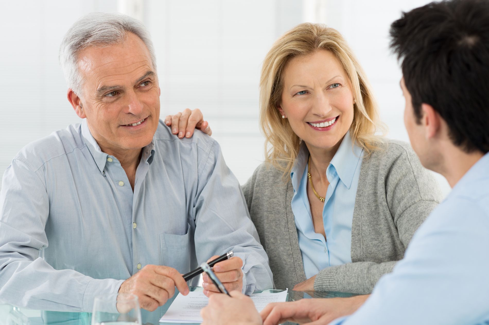 Old couple talking with advisor