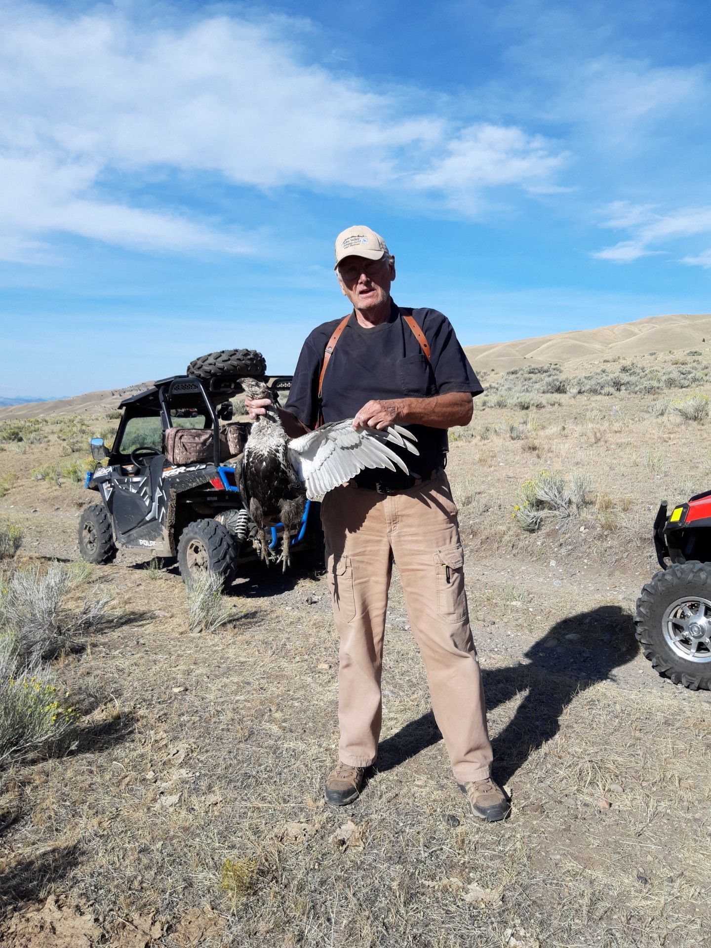 hunter holding a bird
