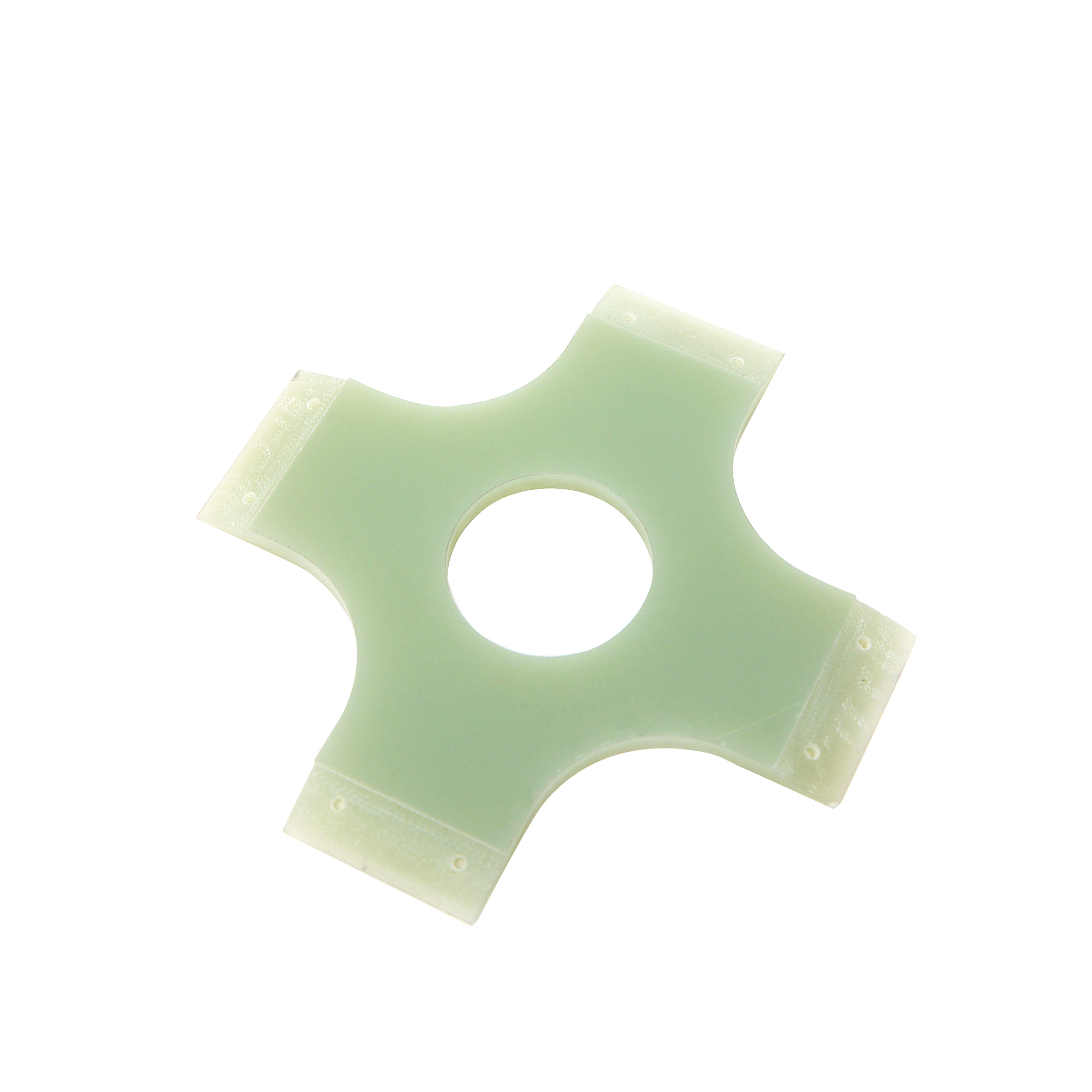 A green plastic ring with a hole in the middle on a white background.