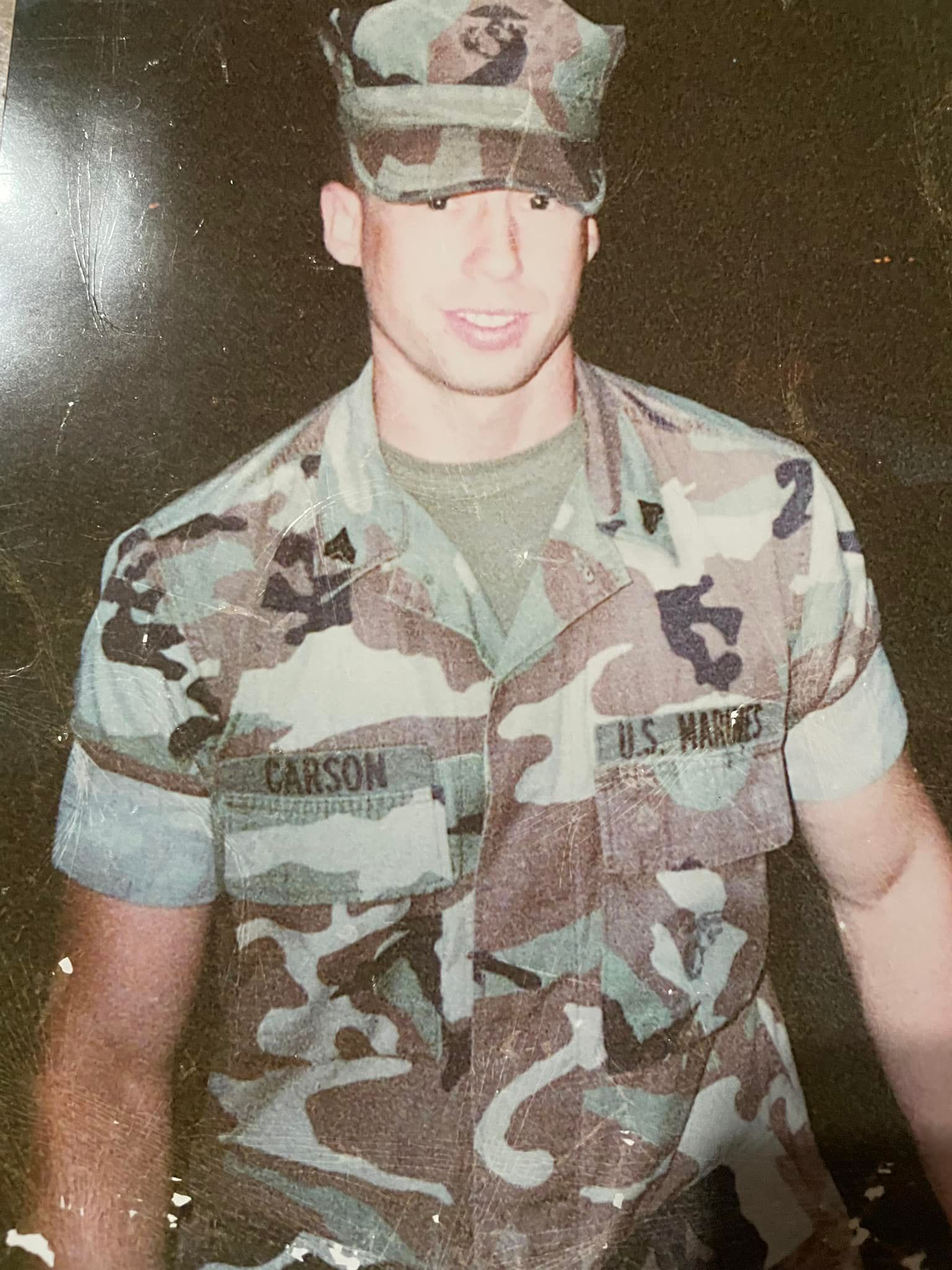 Man in camouflage uniform;