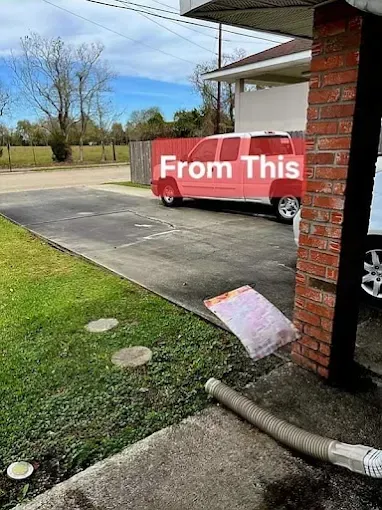 A red truck is partially obscured, with a trash bag falling by a brick column, in an outdoor setting near a driveway.
