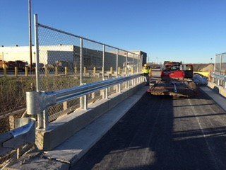 Bridge guide and rail fence installed by Metal Fence Supply Co.