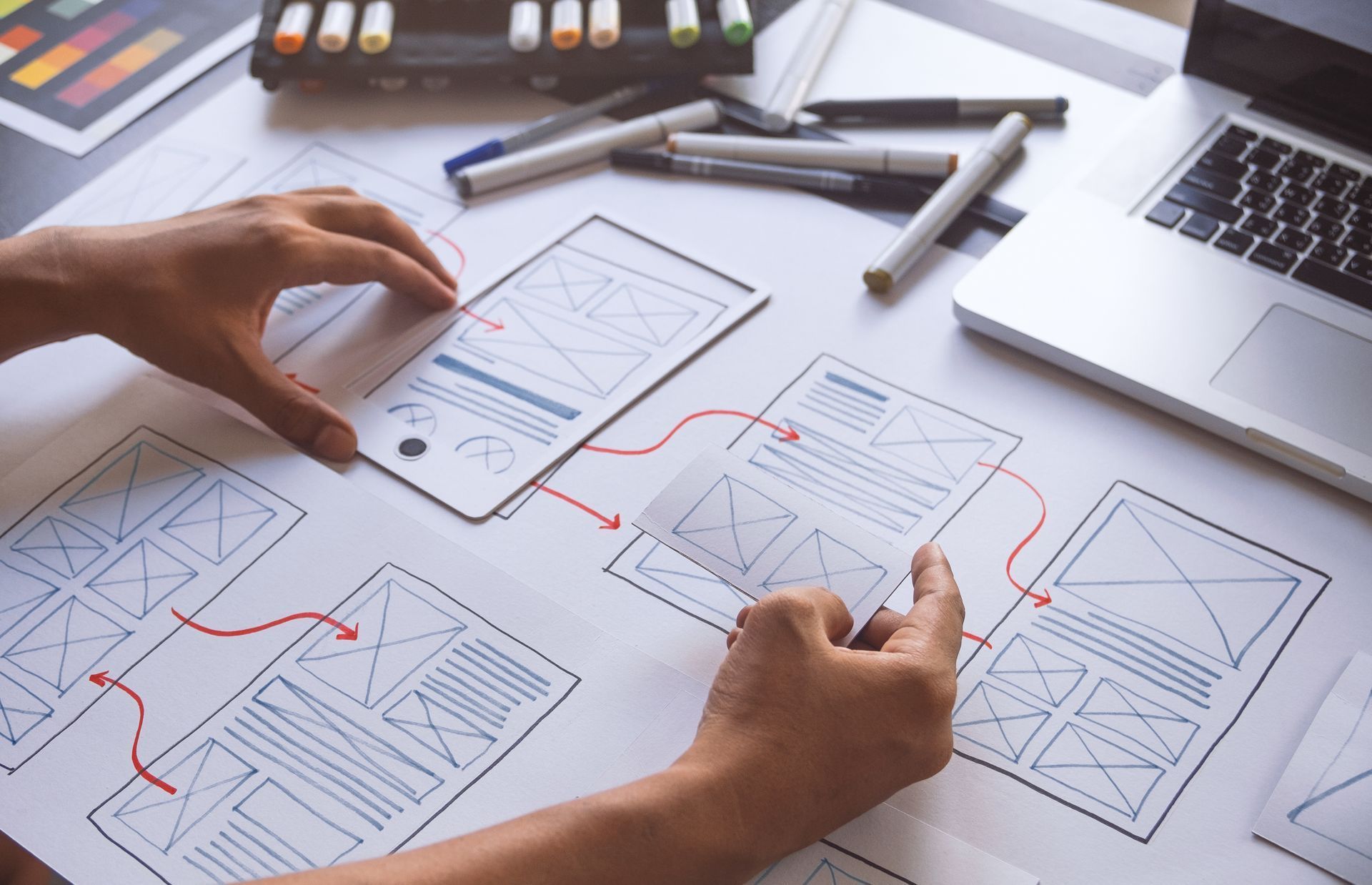 A person is drawing a diagram on a piece of paper.