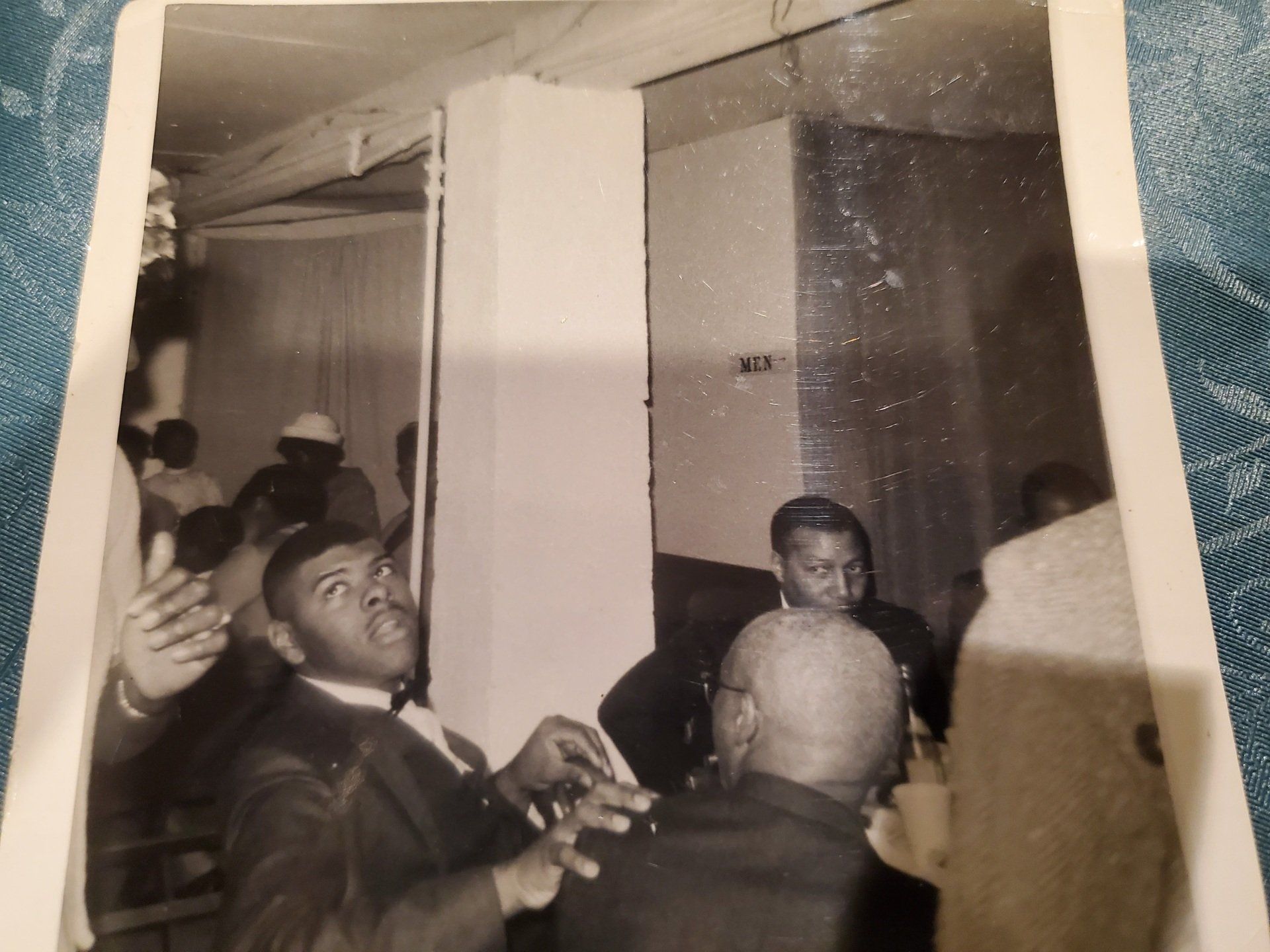 A black and white photo of a man in a suit