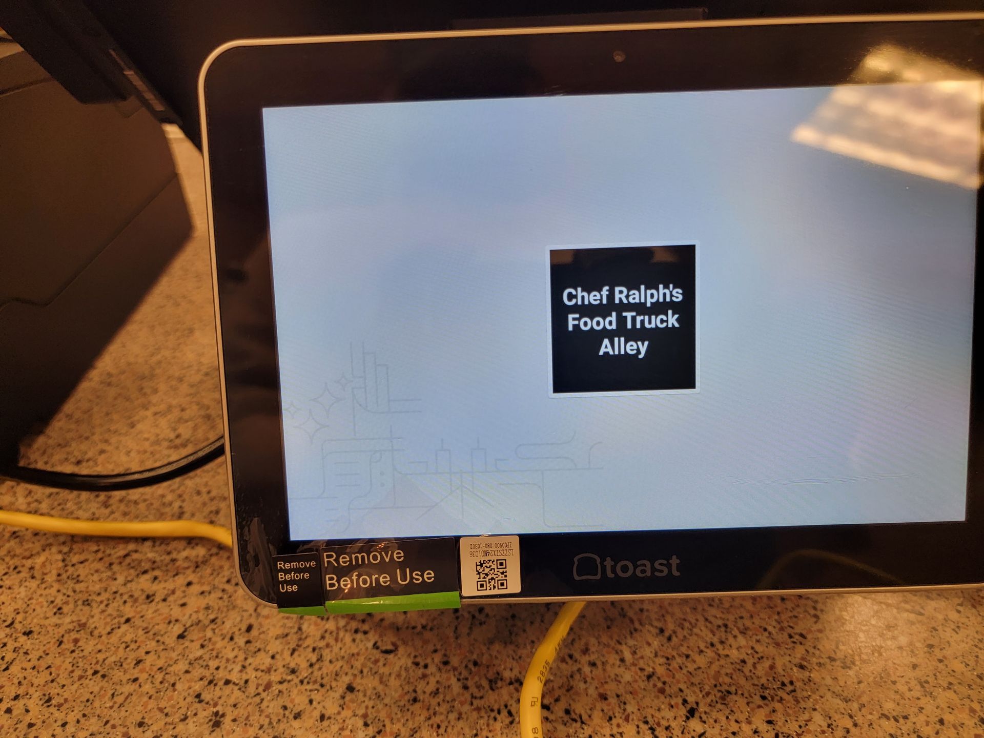 A tablet with a screen that says chef ralph 's food truck alley