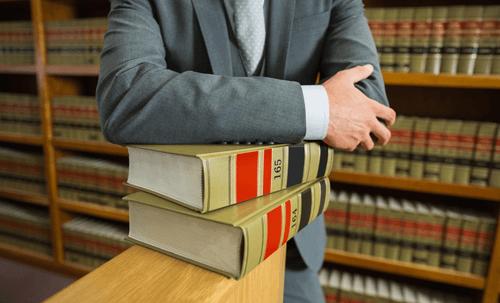 Family Law Attorney Resting on Stack of Books