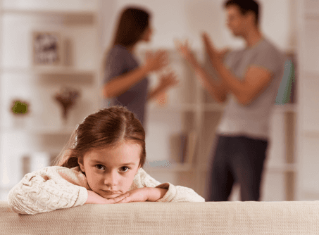 child listening to parents fight in background