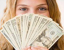 Women holding money — Cerritos, CA — Southern California Security Centers Inc