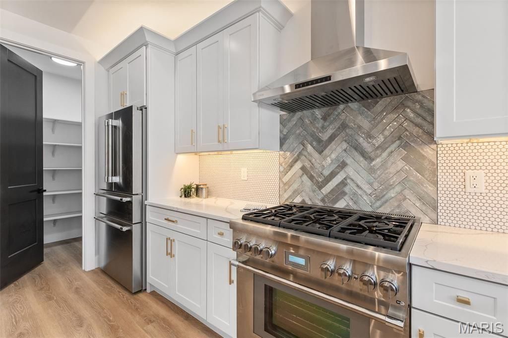 A living room filled with furniture and a fireplace.