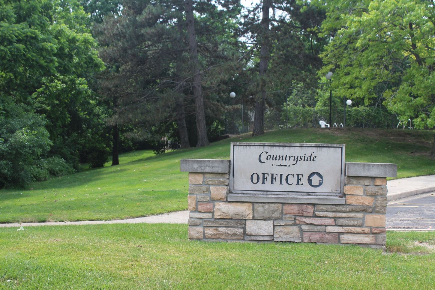 A stone sign that says countryside office on it