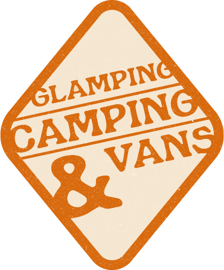 Orange diamond sign reading “Glamping Camping & Vans” in bold text