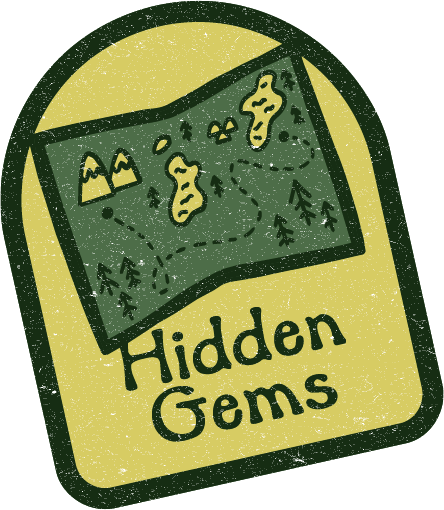 Green badge with a map illustration and the words “Hidden Gems”