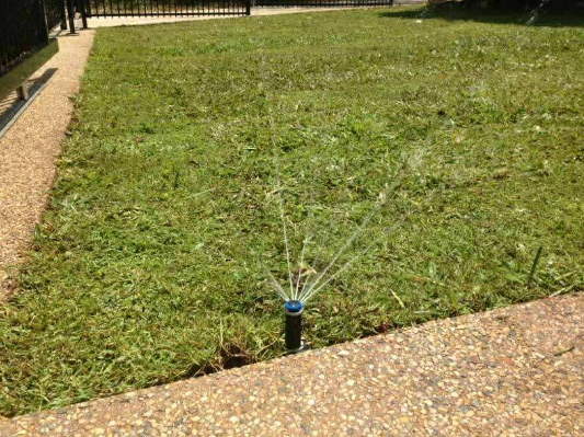 Sprinkler Spraying Garden — Landscaping in Palmerston, NT