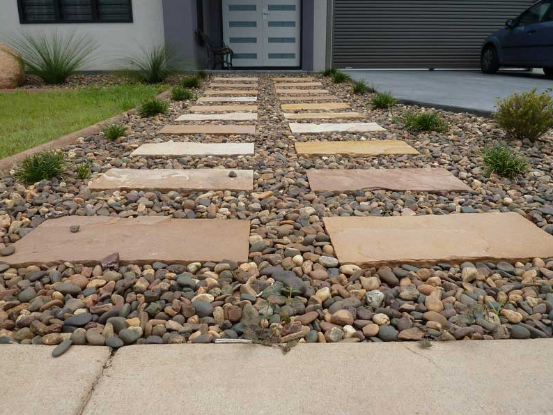 Pebbles Along Stone Steps Leading to House Entrance — Landscaping in Palmerston, NT