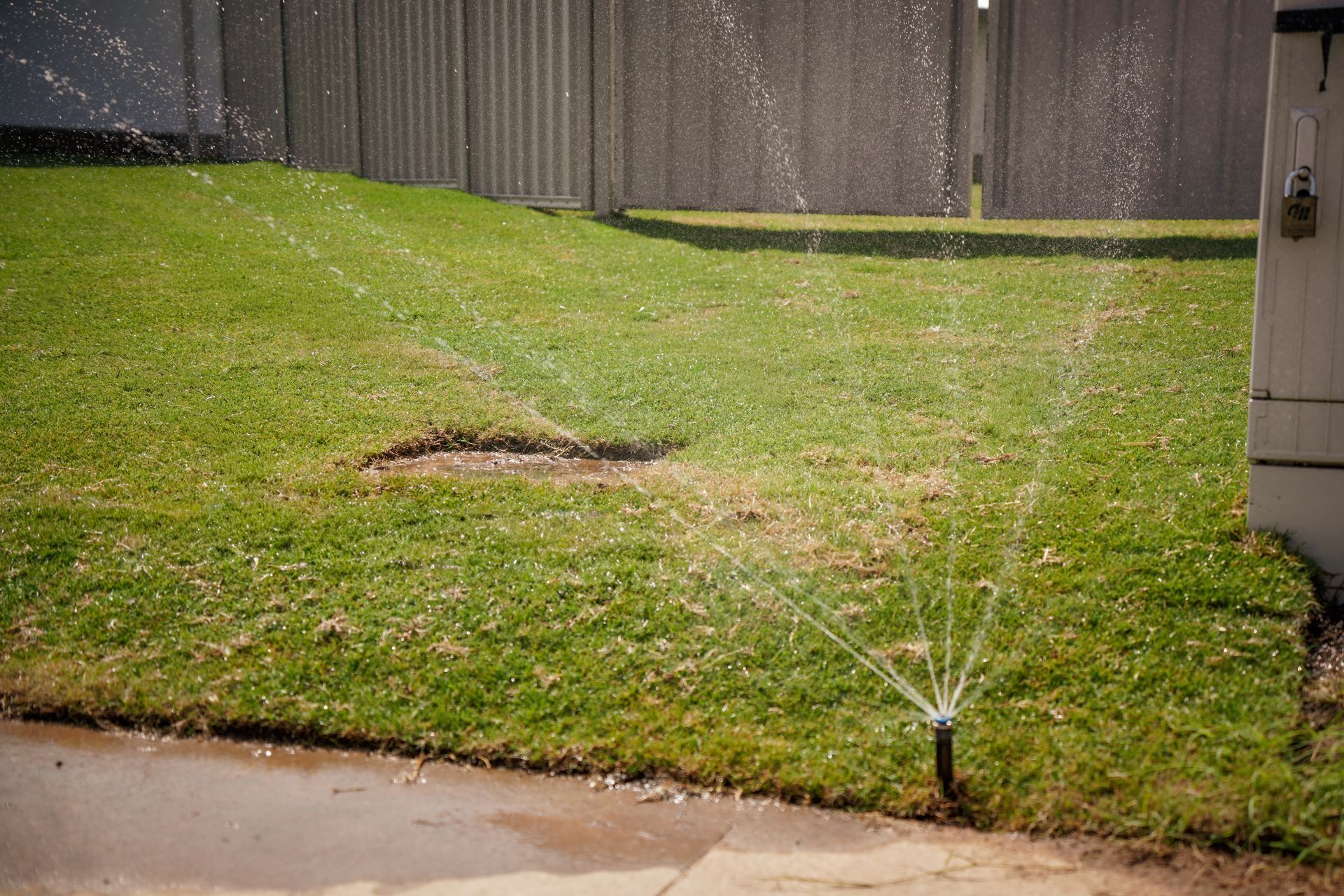 Sprinkler Spray Long Grass — Landscaping in Palmerston, NT