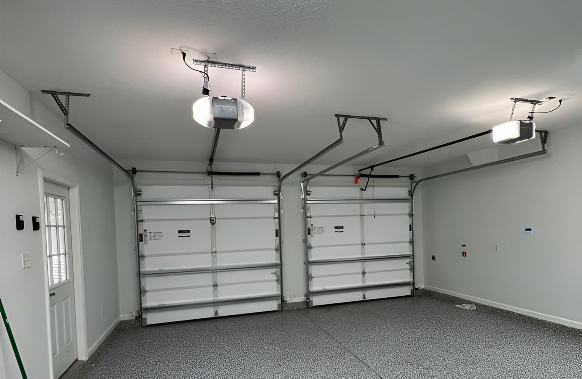 Garage door with battery backup system 