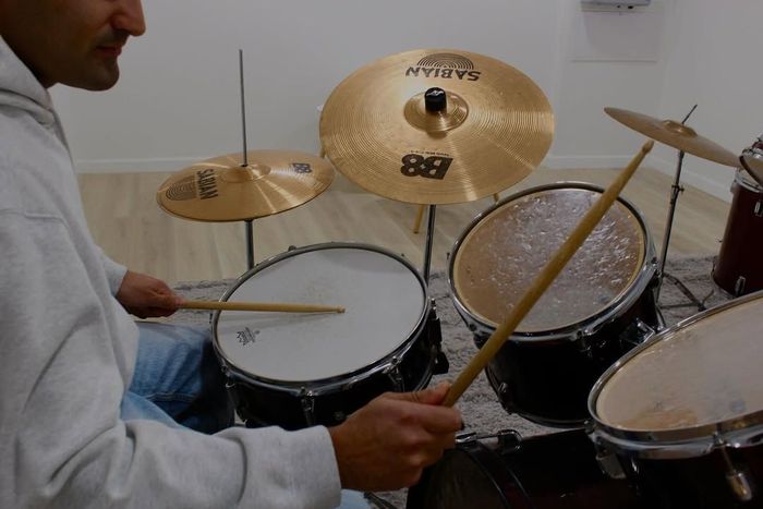 Musician playing the drums.