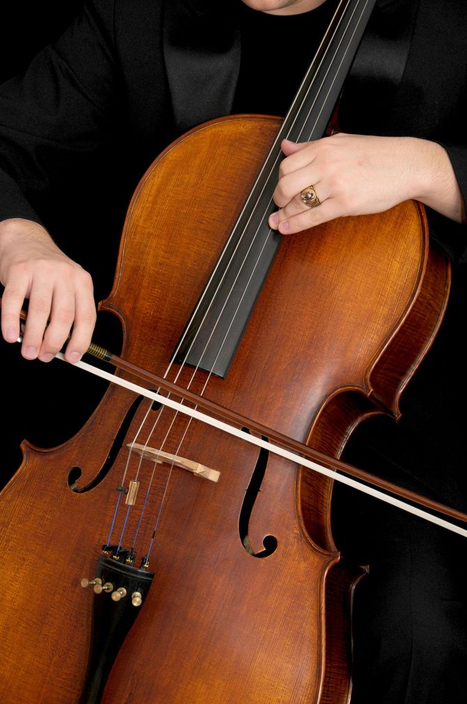 Musician playing cello.
