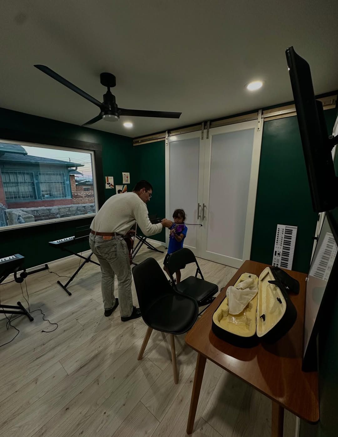 Violin instructor in a lesson with a student.