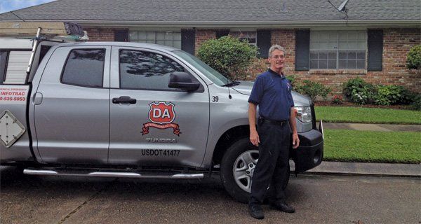 Man Standing Right After The Company Car — Louisiana — DA Exterminating
