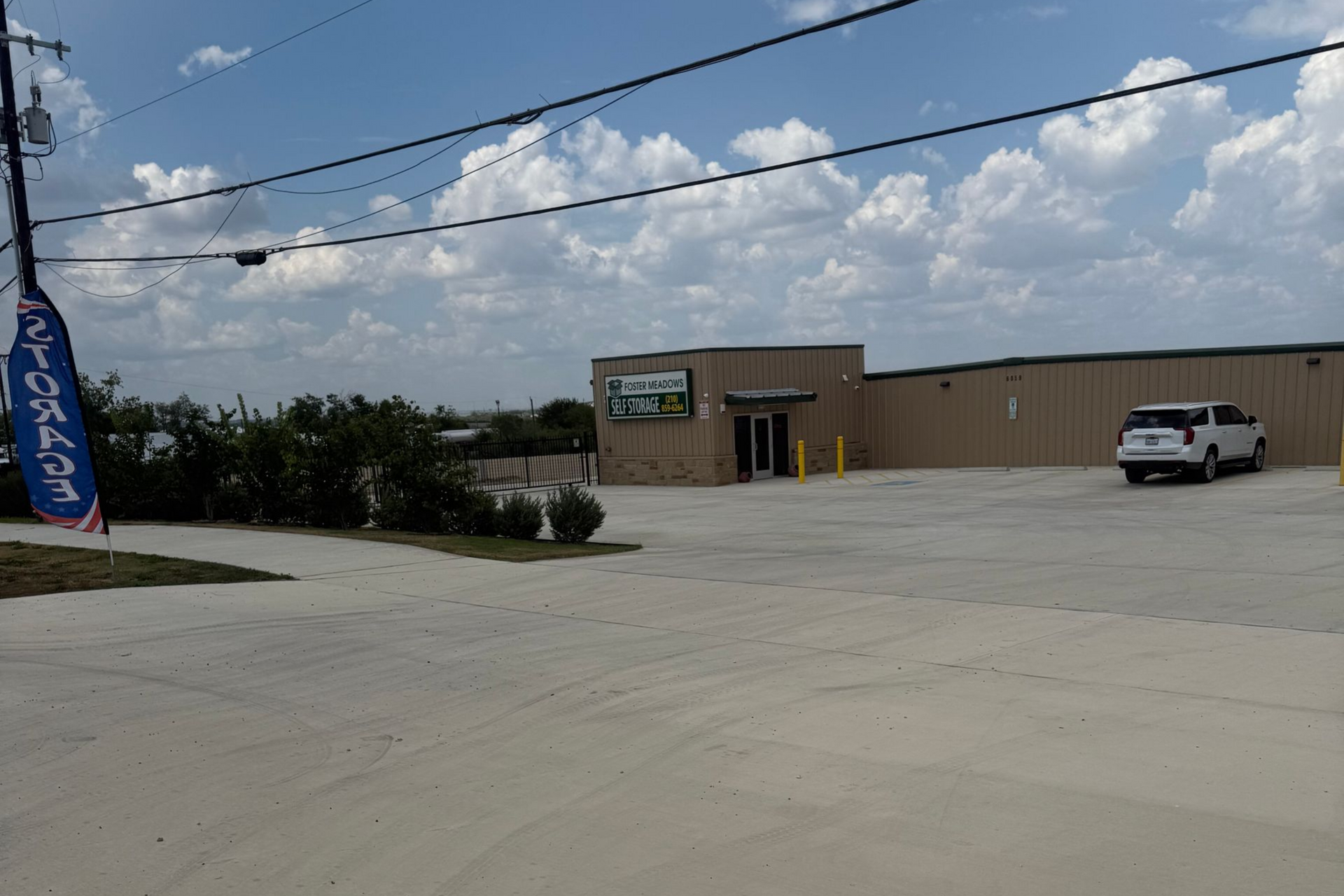 A picture of a parking lot with a building in the background