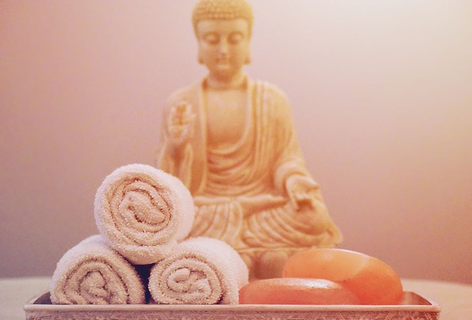 Towels in Front of a Statue — Oceanport, NJ — Red Birch Spa