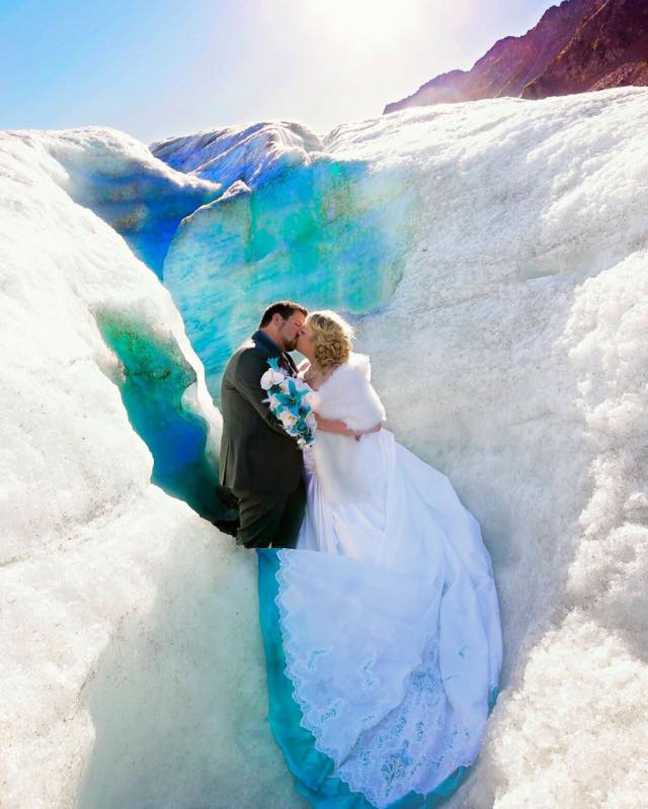 A sunset over a mountain range with a lot of fog