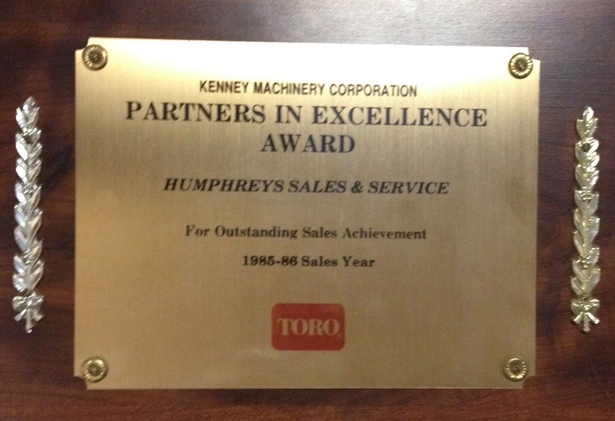 Gold plaque: Kenney Machinery Corporation Partners in Excellence Award to Humphreys Sales & Service