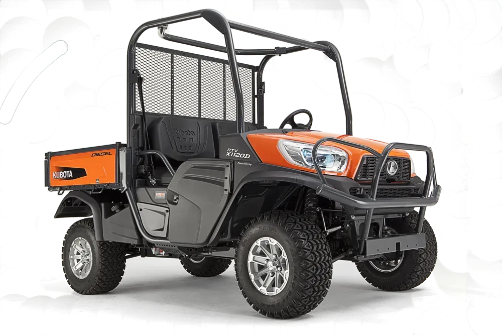 Orange Kubota utility vehicle with black accents and roll cage, outdoors.