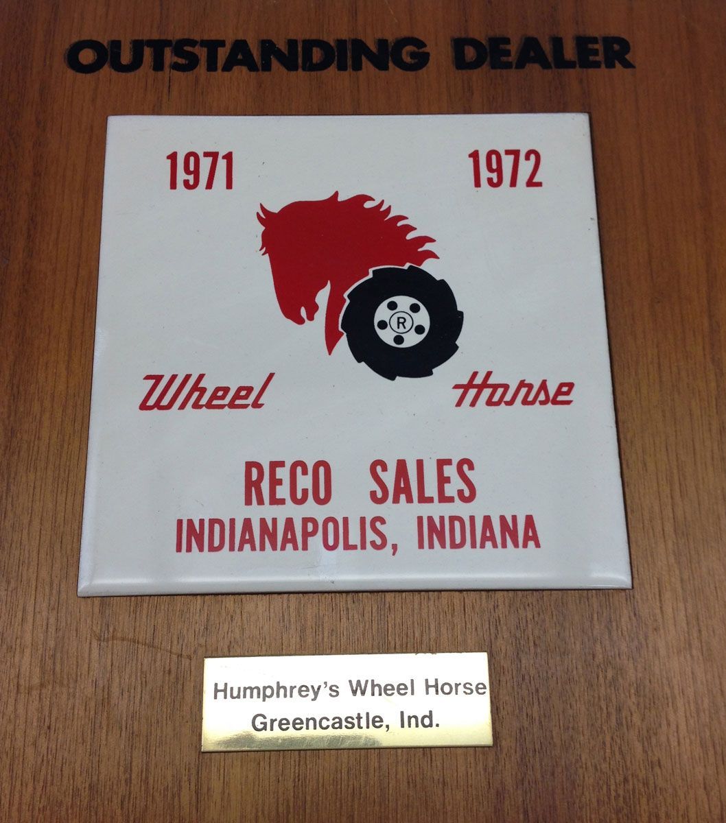 A wooden plaque with an 