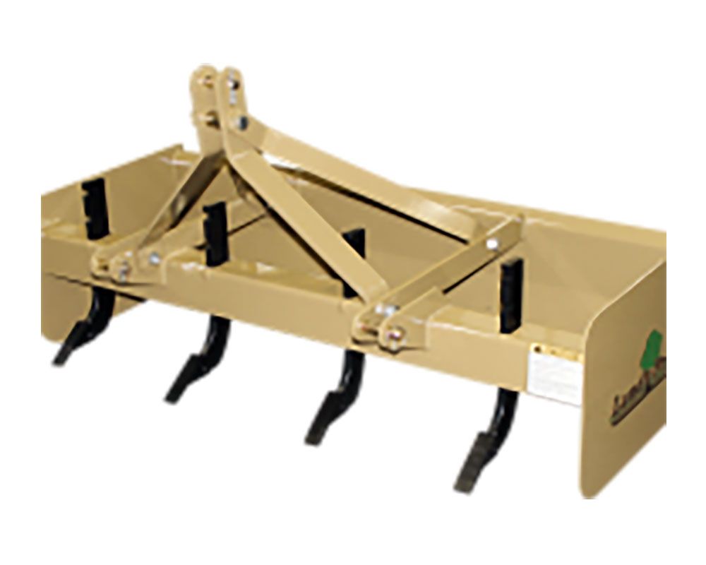 Tan box blade attachment with ripper teeth for a tractor.