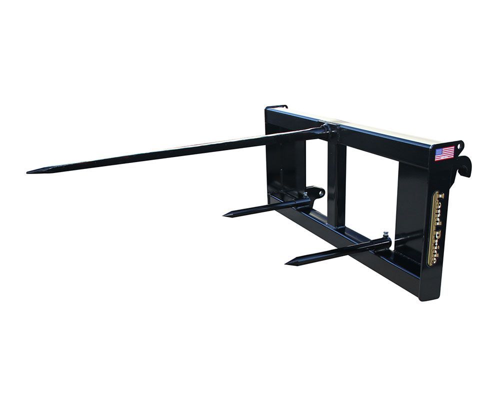 Black hay bale spear attachment for a tractor.