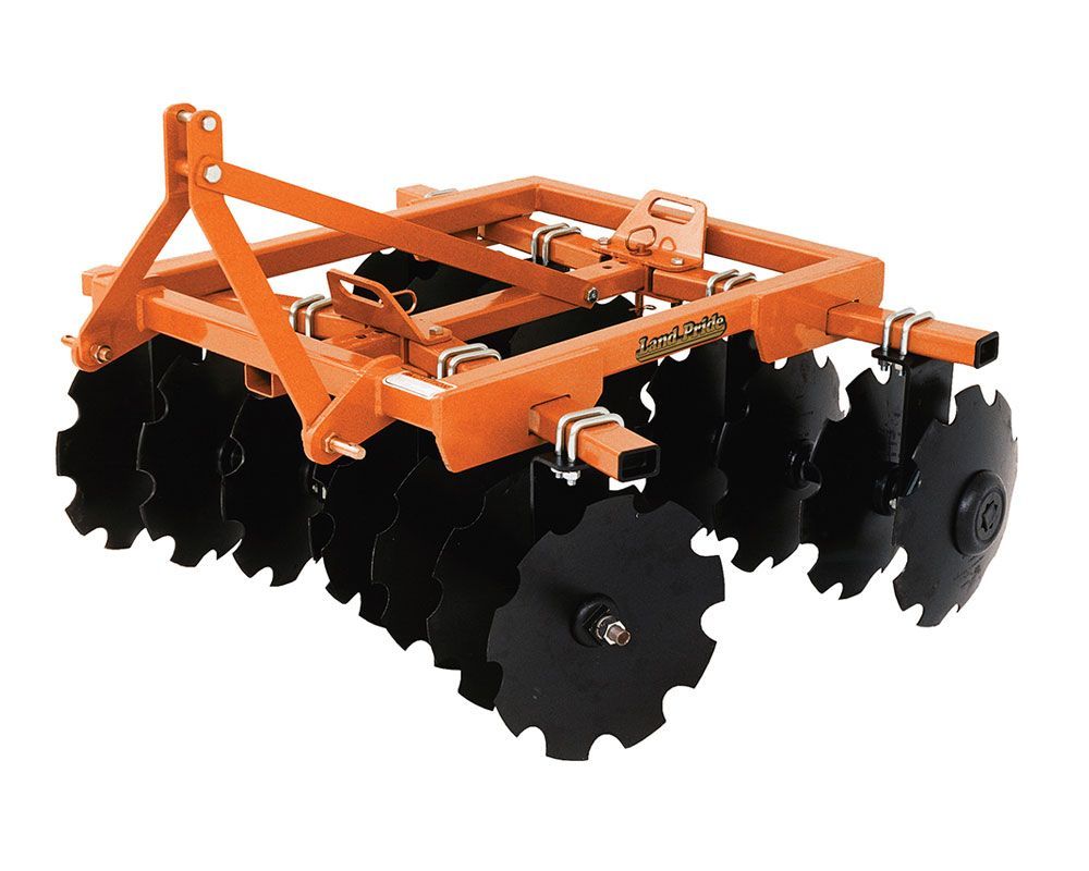 Orange disc harrow agricultural equipment. Black discs rotate to till soil.