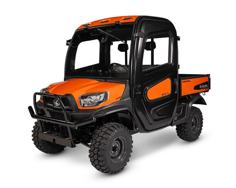 Orange and black Kubota utility vehicle with a cab and rugged tires.