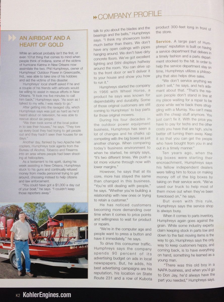 Man stands by a red boat. Company profile article about him with text on white pages.