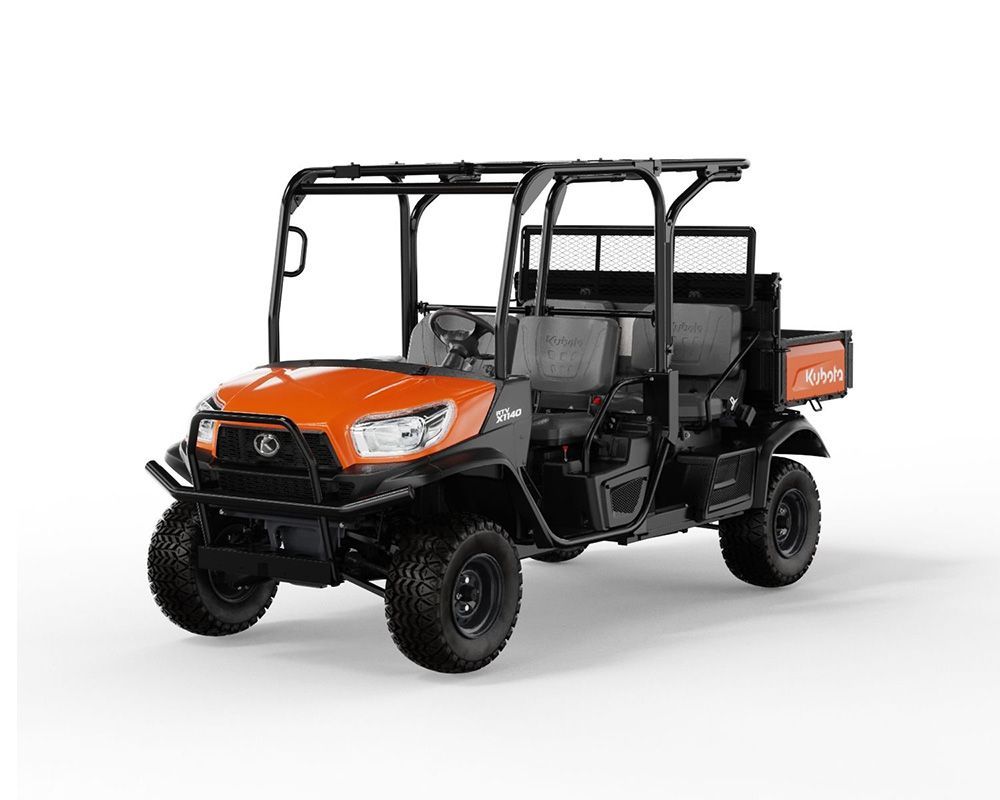 Orange and black Kubota utility vehicle with a roll cage, parked outside.