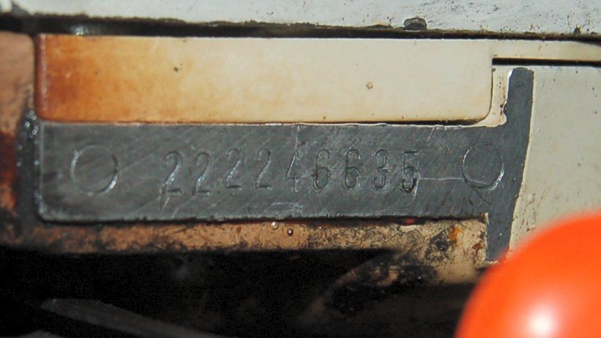 Metal plate with the stamped number 