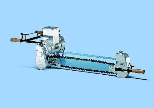 Vintage chain saw on a blue background.