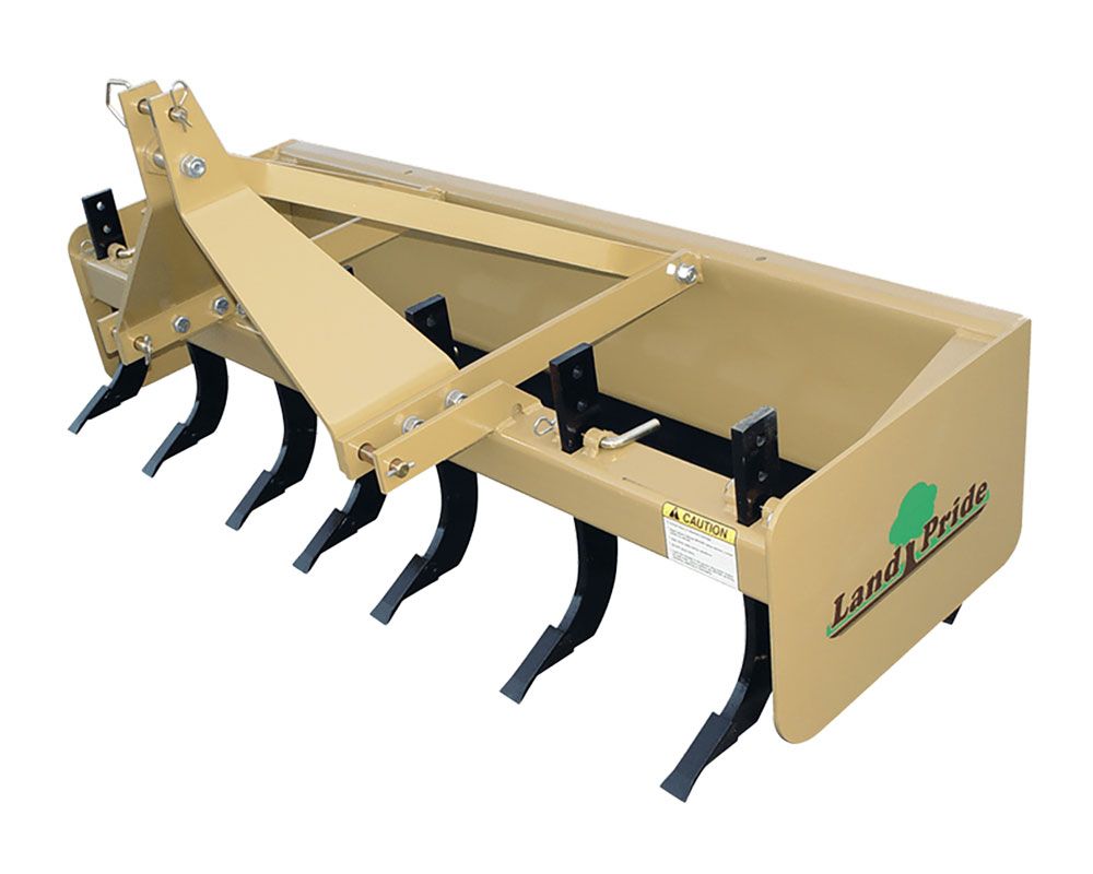 Tan Land Pride box blade with black tines, used for leveling and grading soil, with a three-point hitch.
