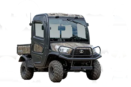 Dark-colored UTV with camo accents, cab, and brush guard, parked on a white background.