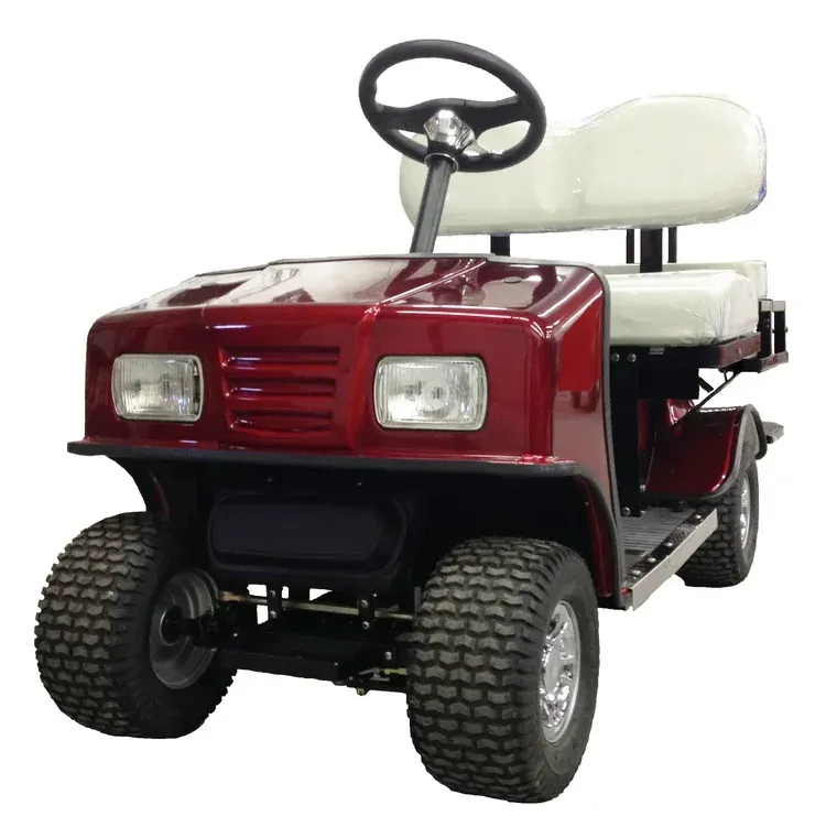 Red golf cart with white seats and black steering wheel.