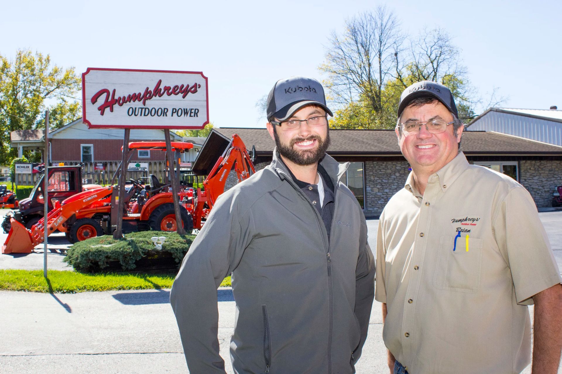 Two men stand in front of